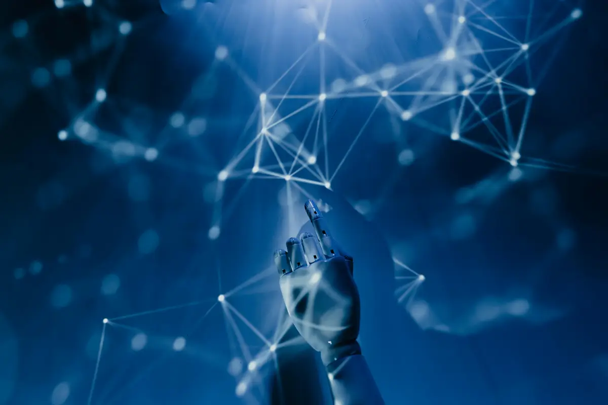 A robotic hand reaches out into a rendering of cyberspace to touch a specific data point