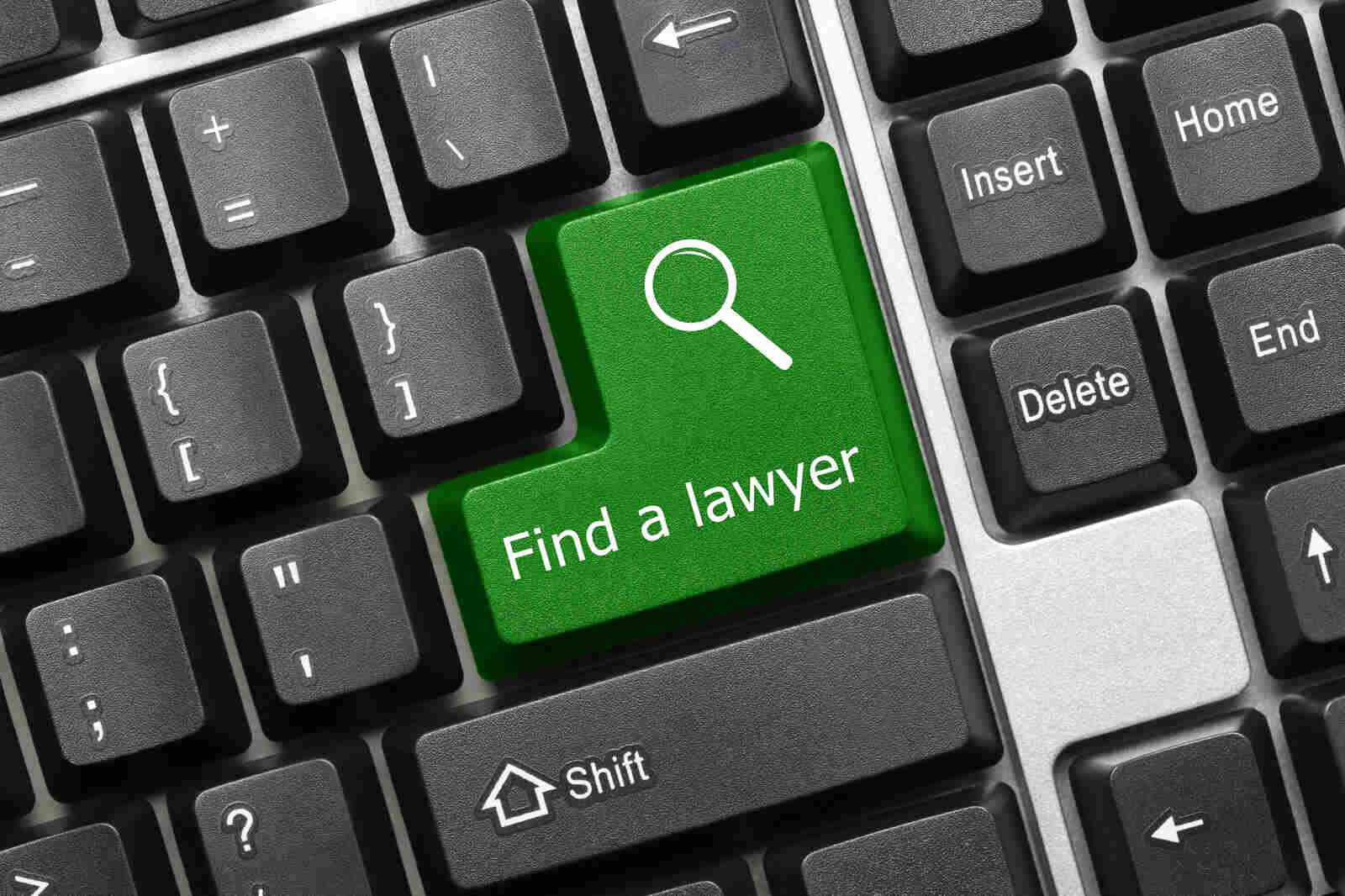 Concept image: close-up of a mechanical computer keyword with the large 'Enter' key replaced with a 'Find A Lawyer' key.