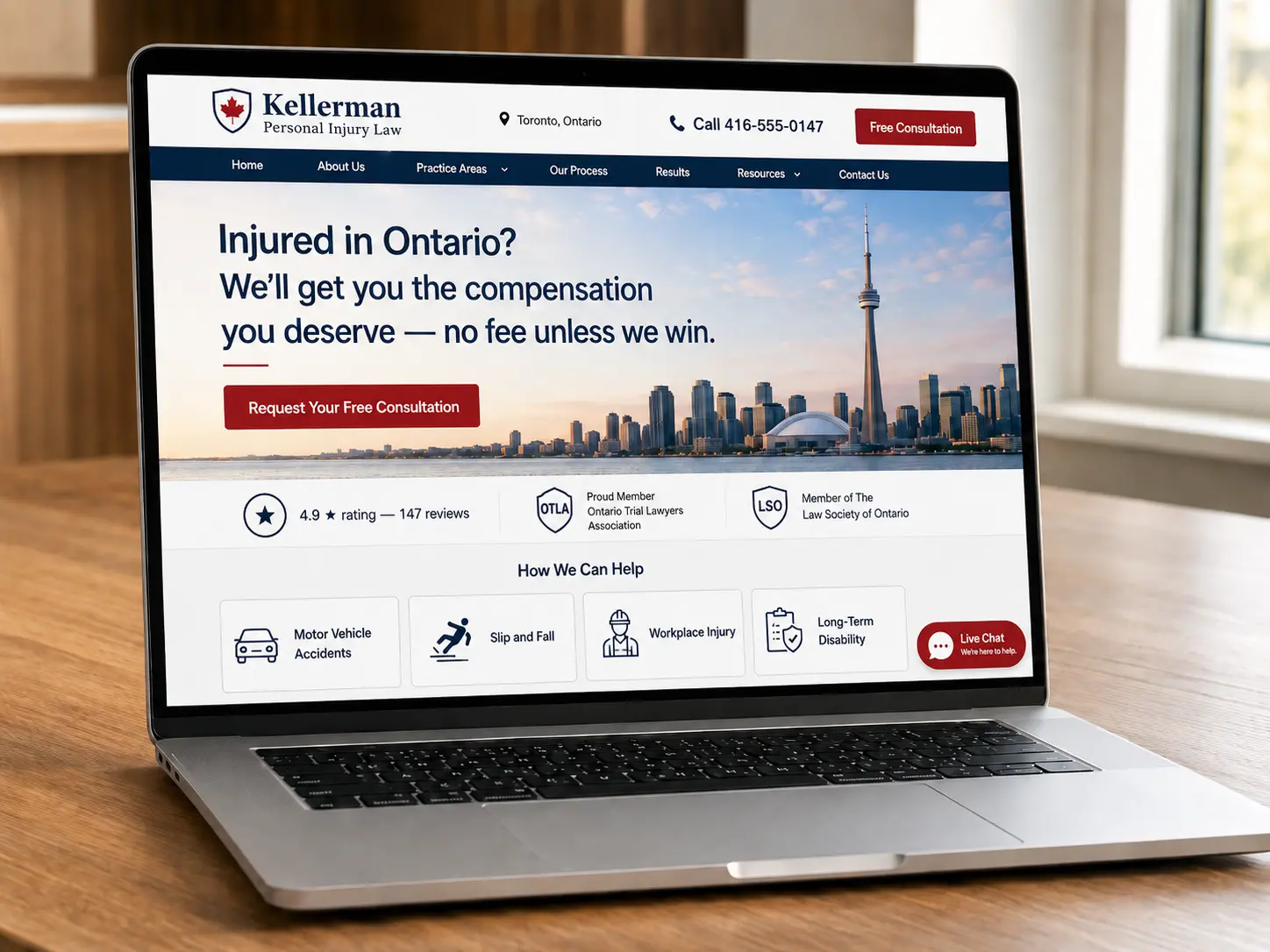 A laptop on a wood desk displays a fictional Toronto personal injury law firm homepage with a phone CTA, free consultation button, trust signals, live chat, and practice area cards.