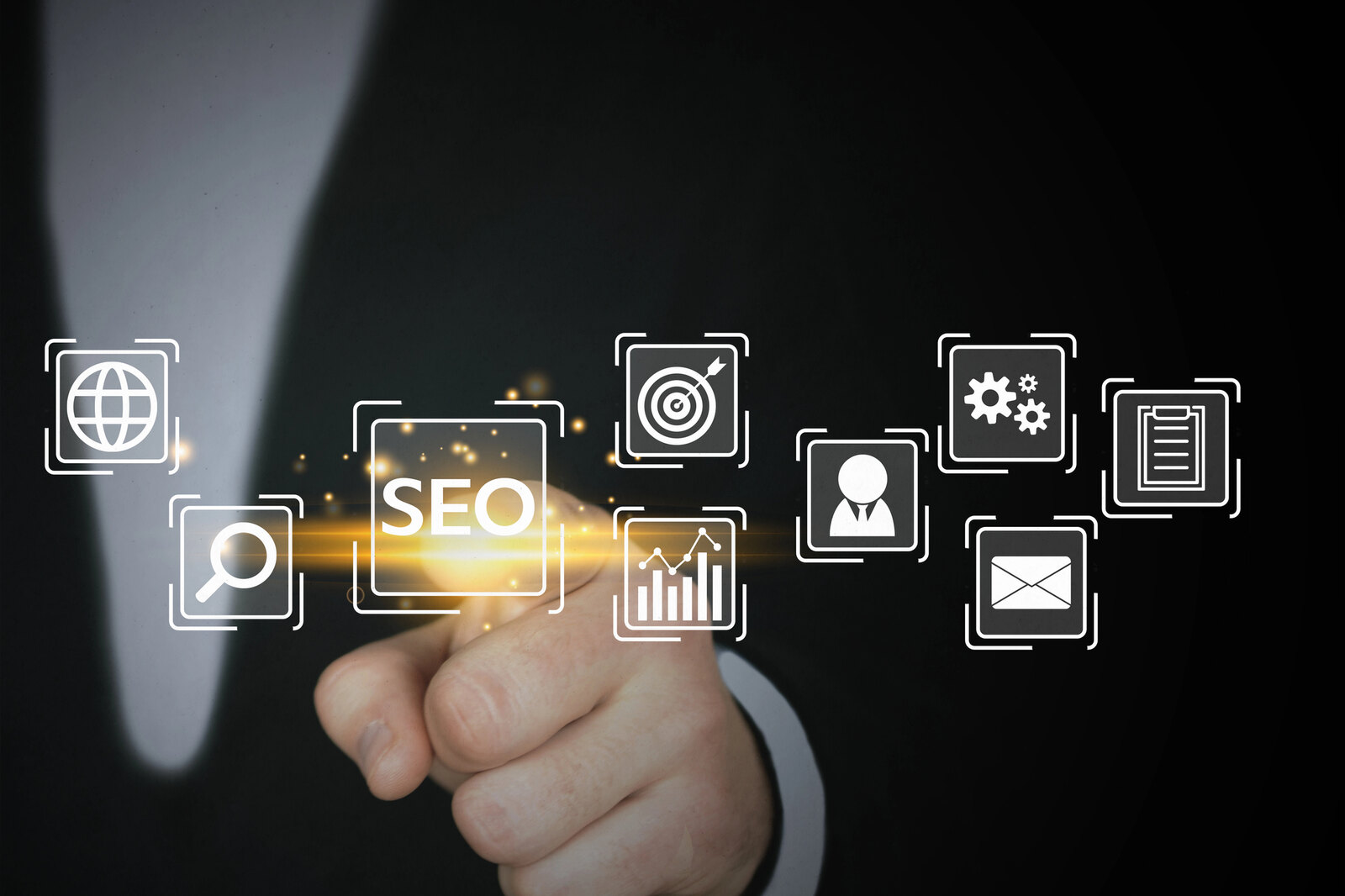 Concept image: close-up of a lawyer pointing to a floating 'SEO' button, hovering in the air amongst various other website icons.