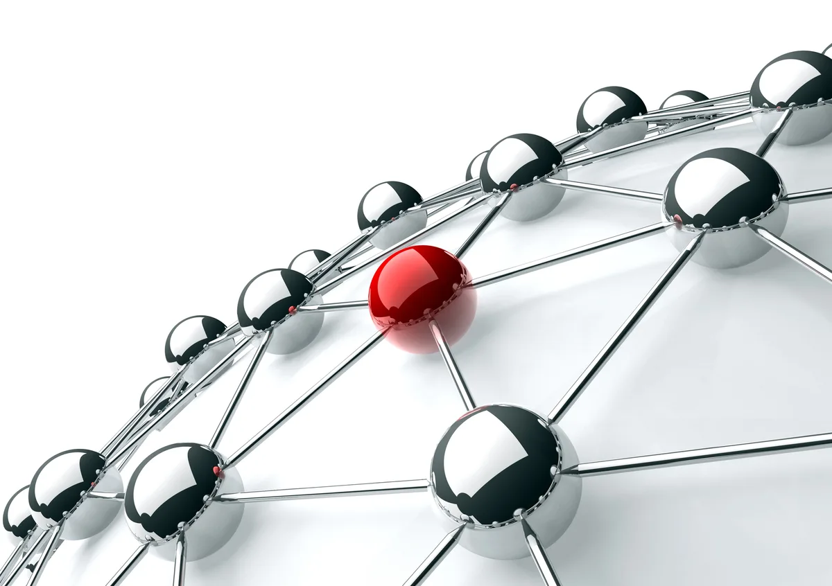 3D network of chrome spheres joined by metal rods, with a single red sphere linked into the web at its centre