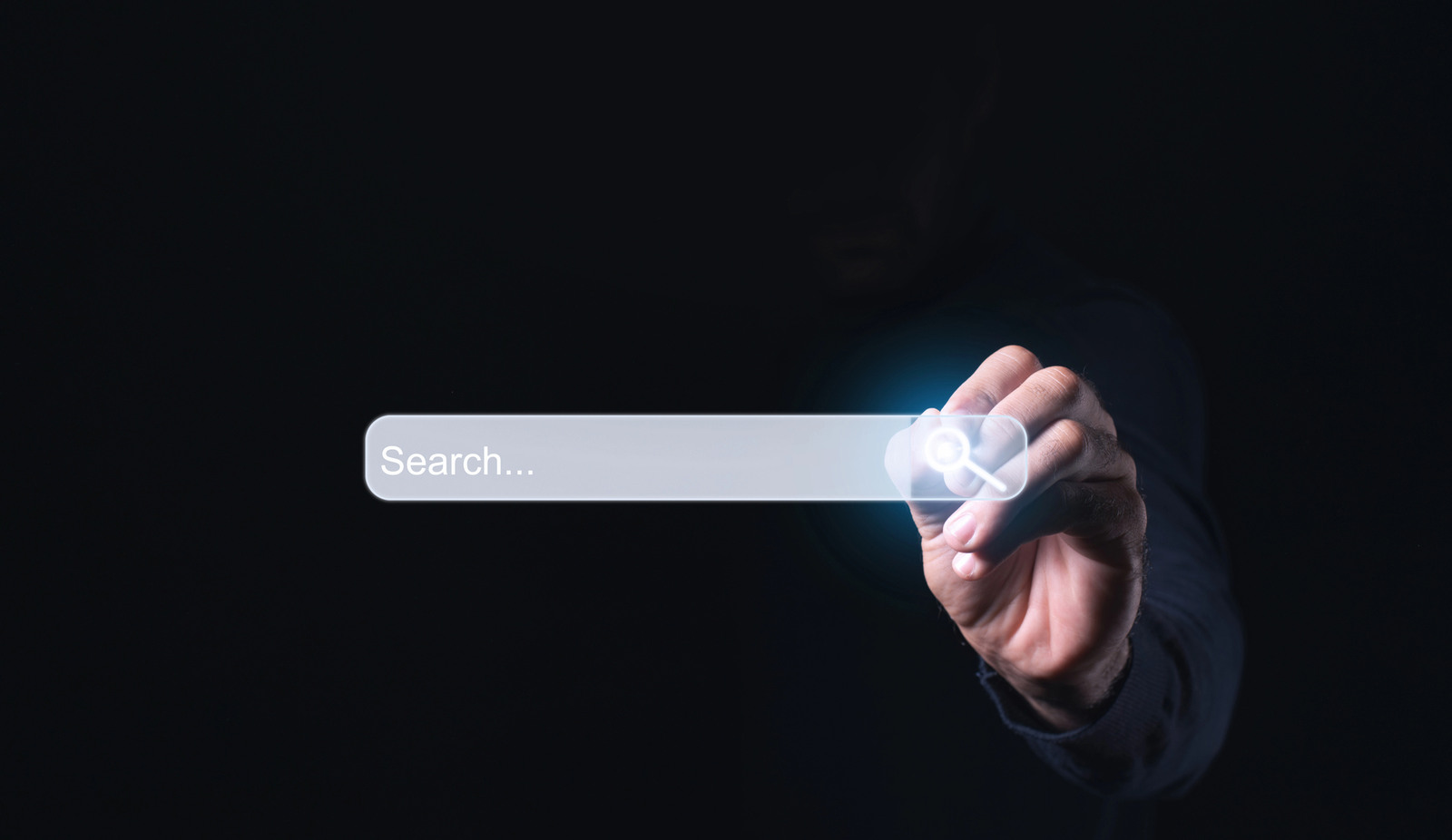 Internet search page being clicked on a computer's touch screen by a businessman while searching the internet