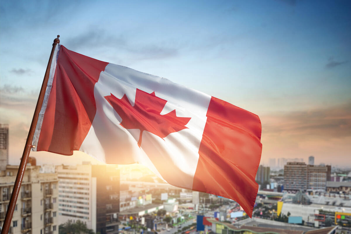 Canadian flag with city skyline