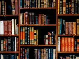 Bookshelves full of colourful and dense text books