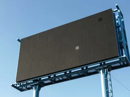 A blank digital billboard awaits a new advertisement