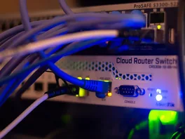 Network cables running to and from various cloud server hardware