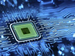 Close-up of a microchip integrated on a computer motherboard, surrounded by circuitry